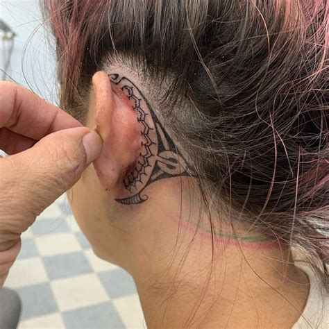 tribal ear tattoo